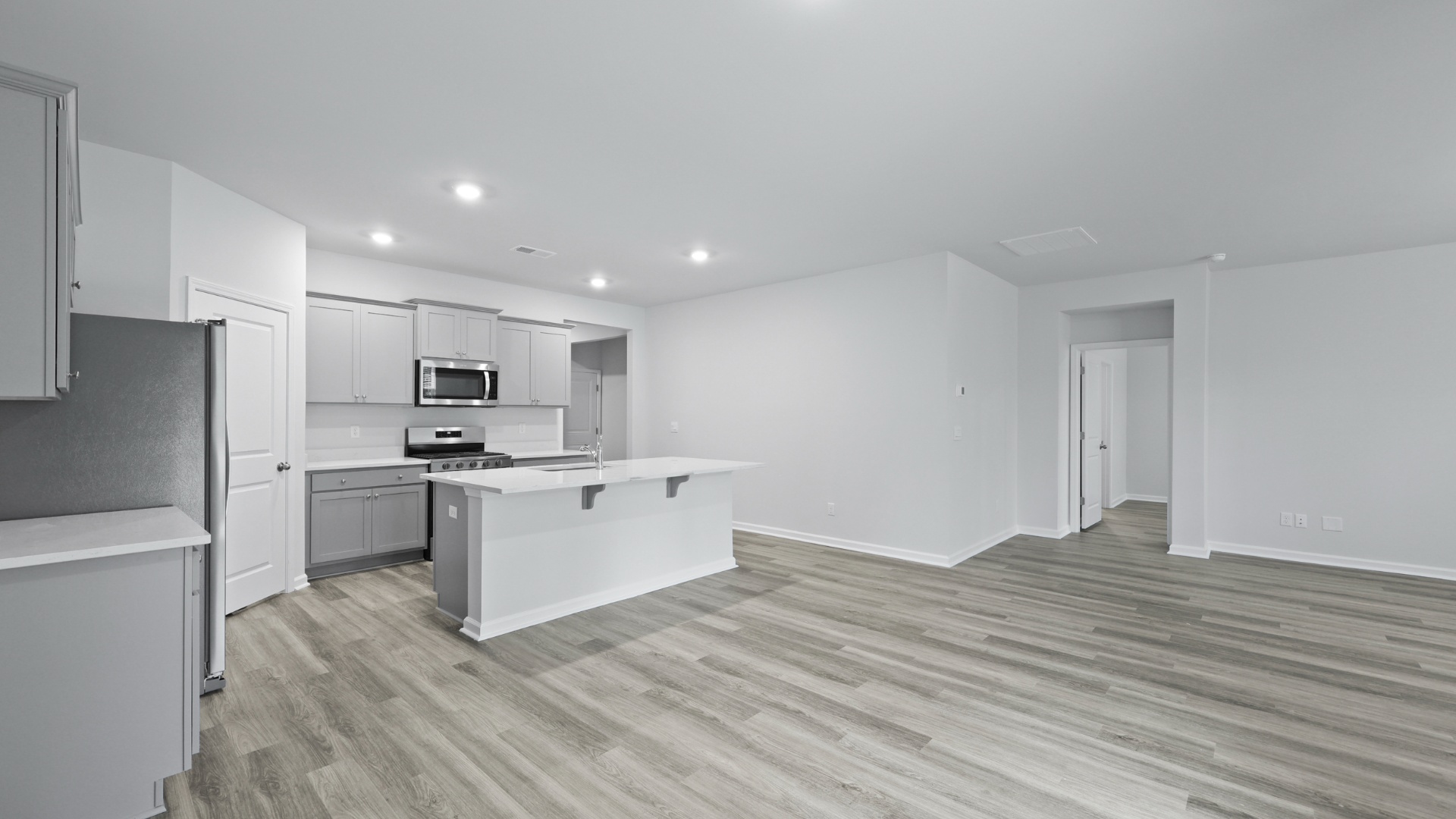 Vinyl floors finish the main living areas of the single-story home for sale in Lugoff, SC