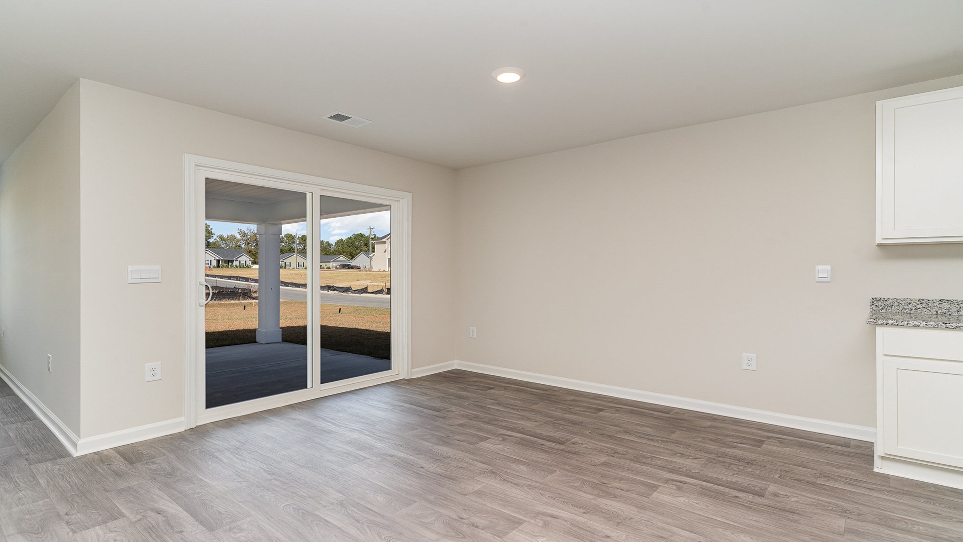 Dining area with glass sliding doors leading to back patio