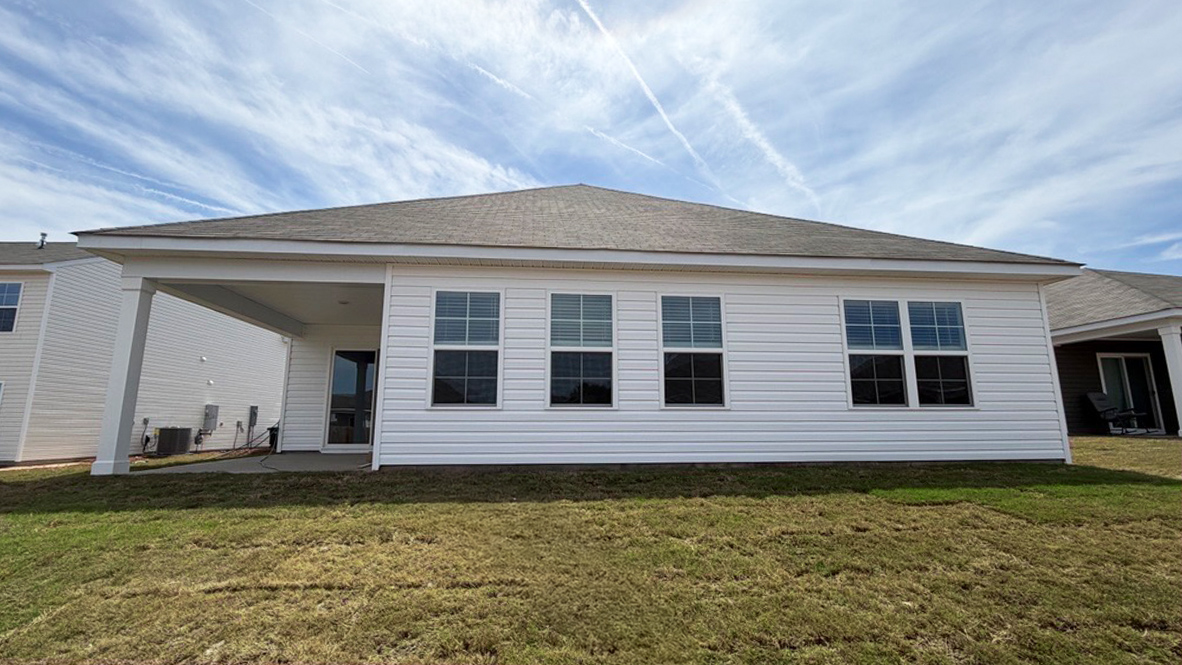 Back exterior of the home with covered back patio