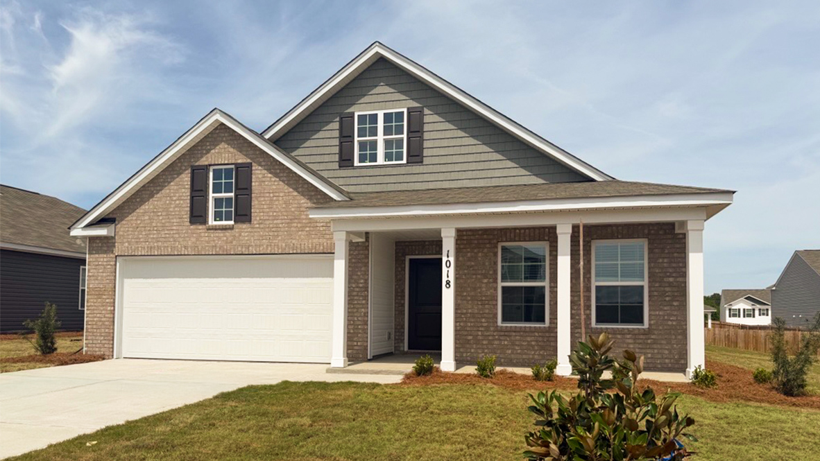 Two-story home for sale with partial brick