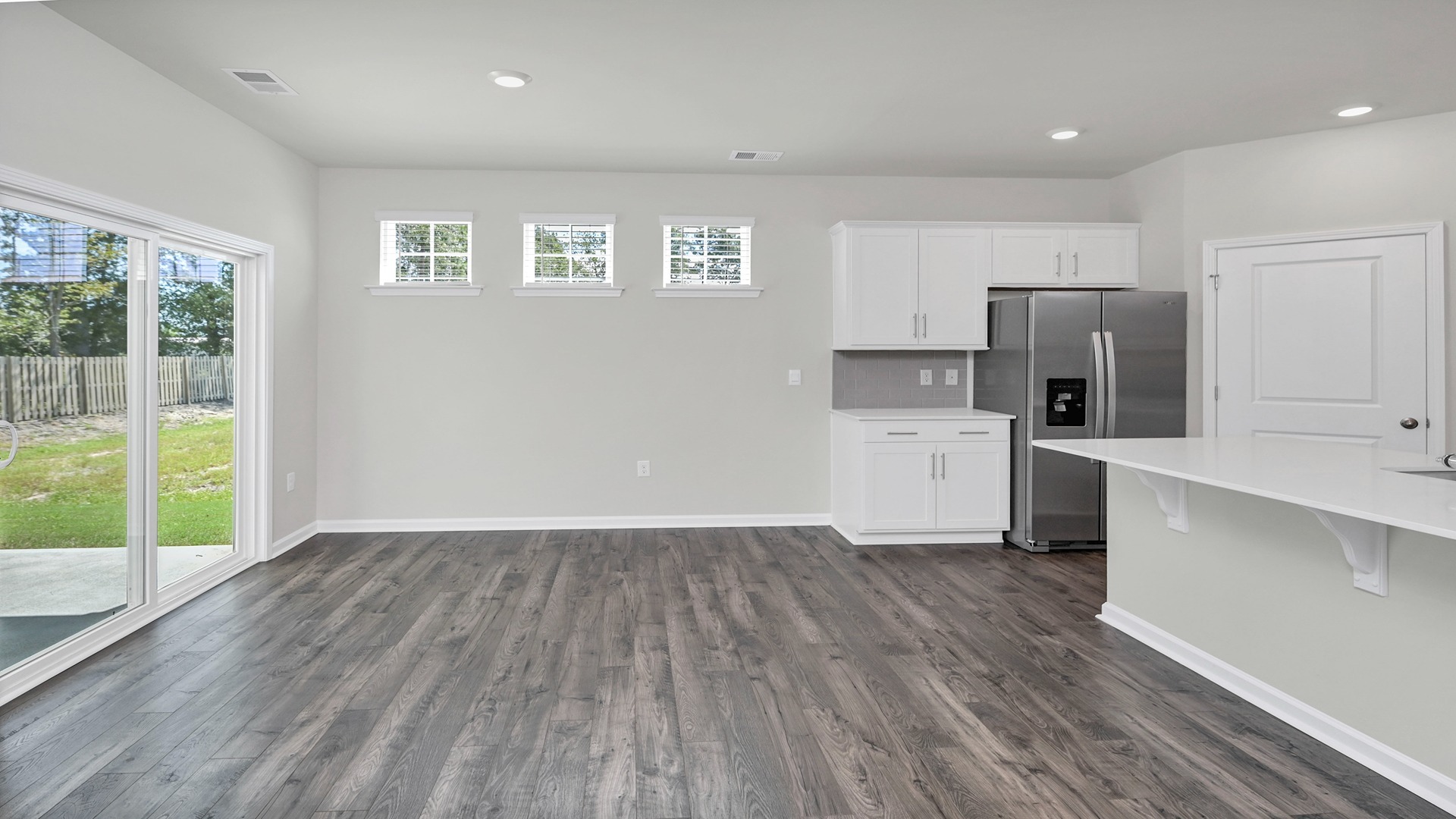 Dover dining area with natural light and vinyl flooring