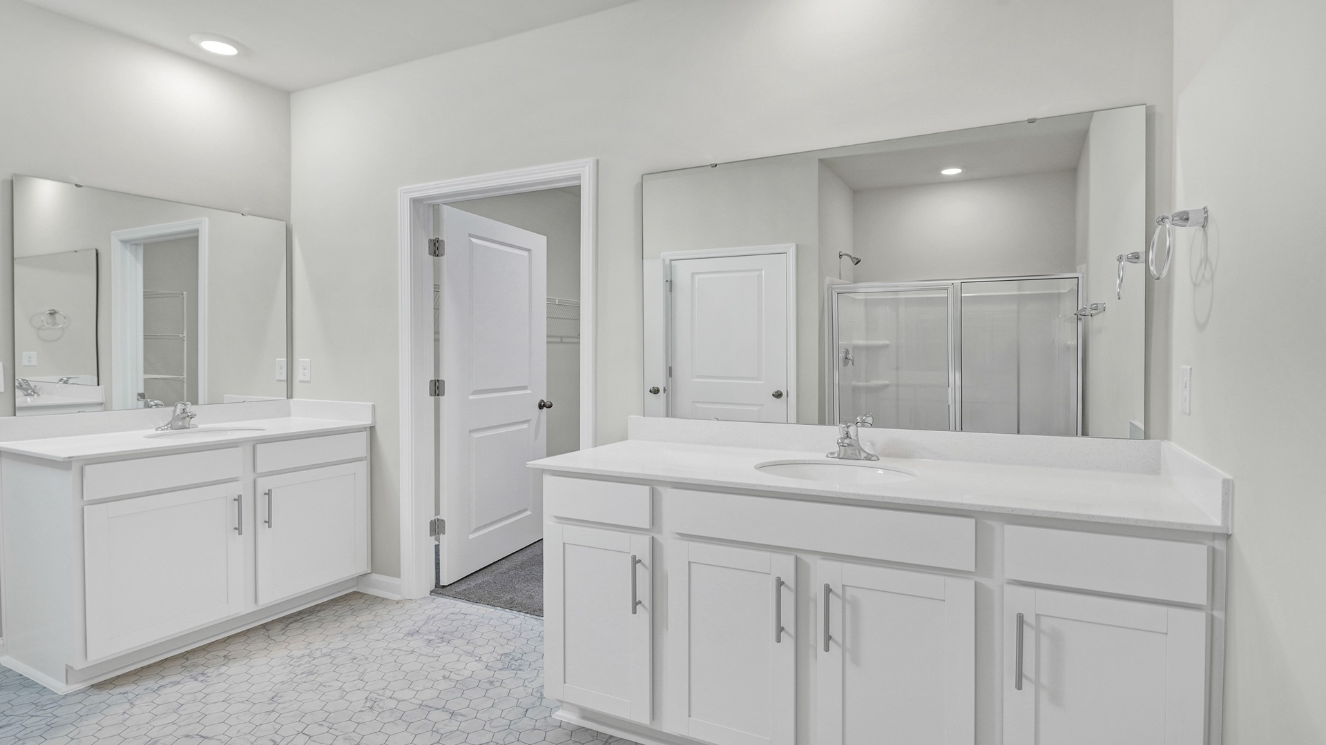 Double primary vanity with white cabinetry
