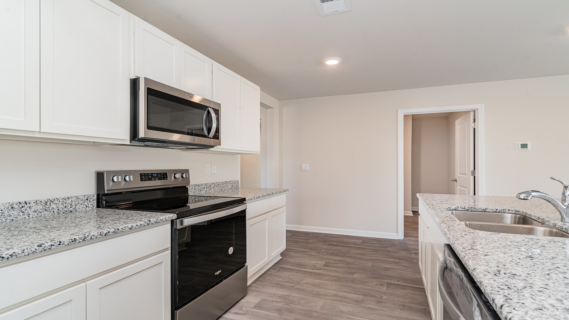 Stainless steel appliances and granite countertops in the kitchen