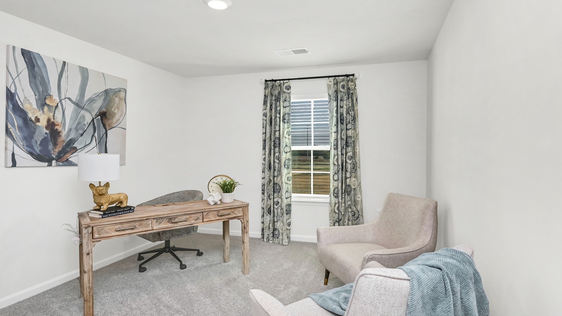 Upstairs bedroom staged as a home office