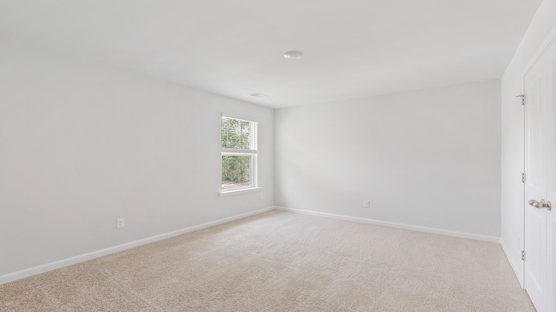 Bedroom 3 upstairs with carpet flooring and a window