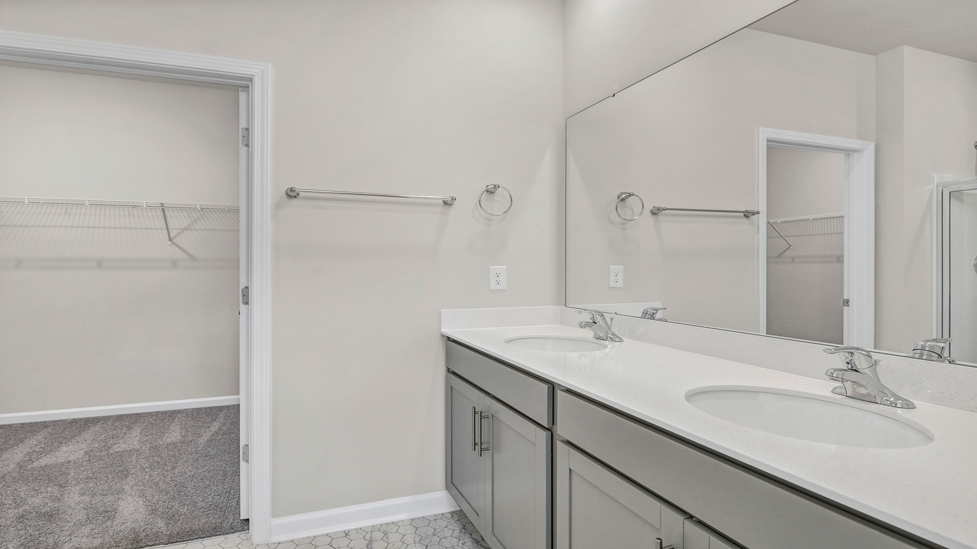 En-suite primary bathroom and walk-in closet