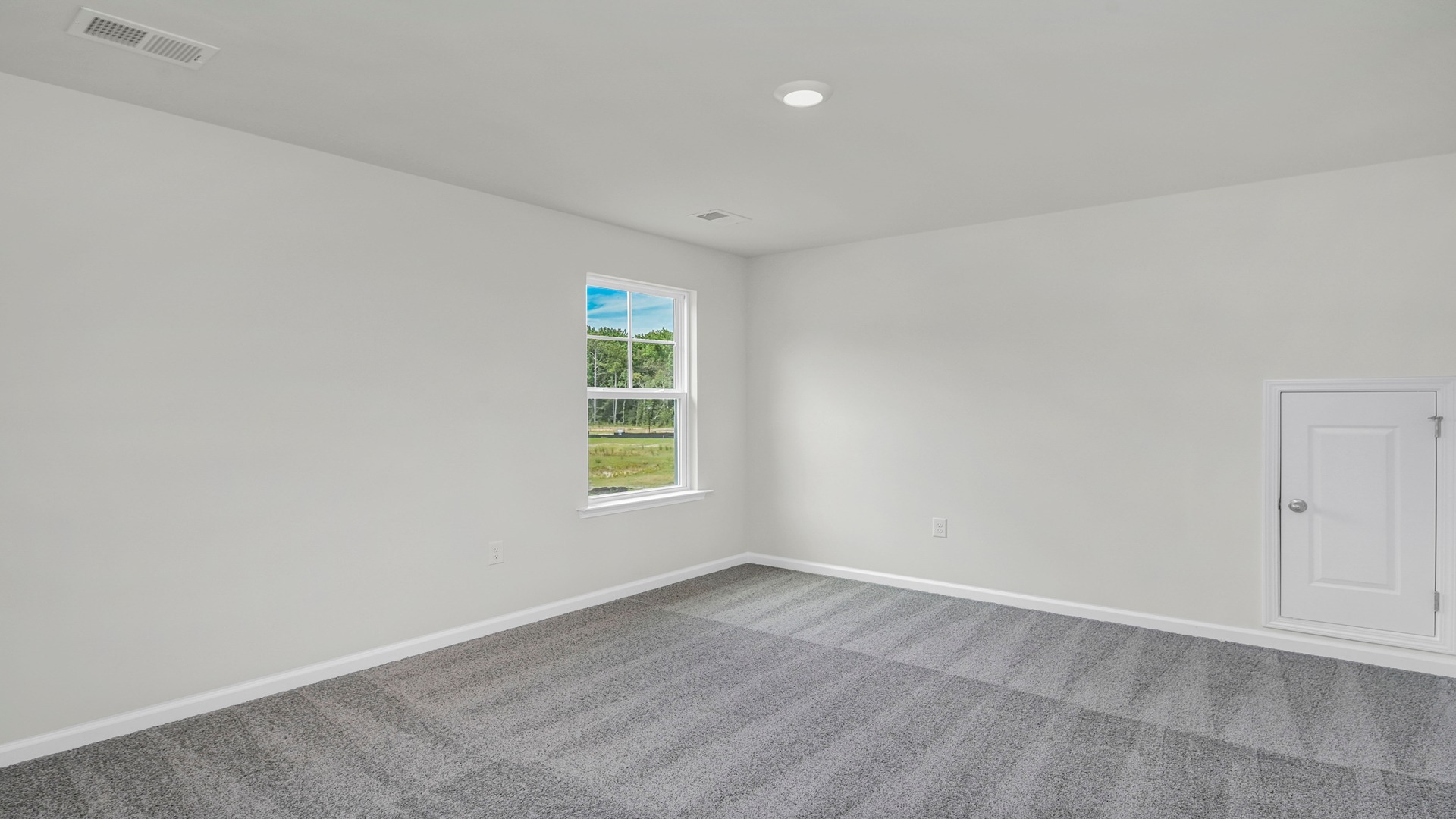 Bedroom 2 upstairs with carpet flooring and a window for light