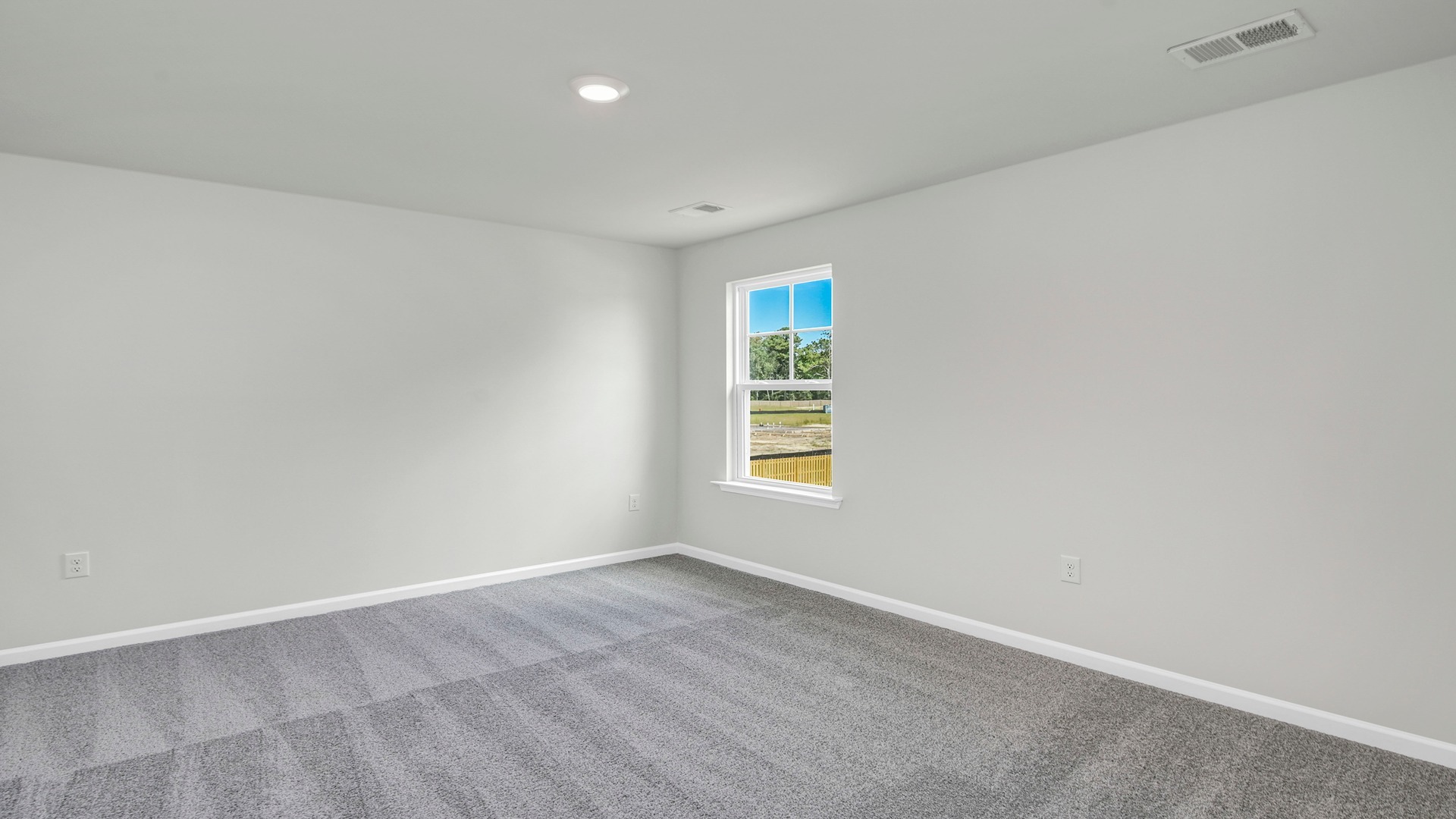 Bedroom 3 upstairs with carpet flooring and a window for light