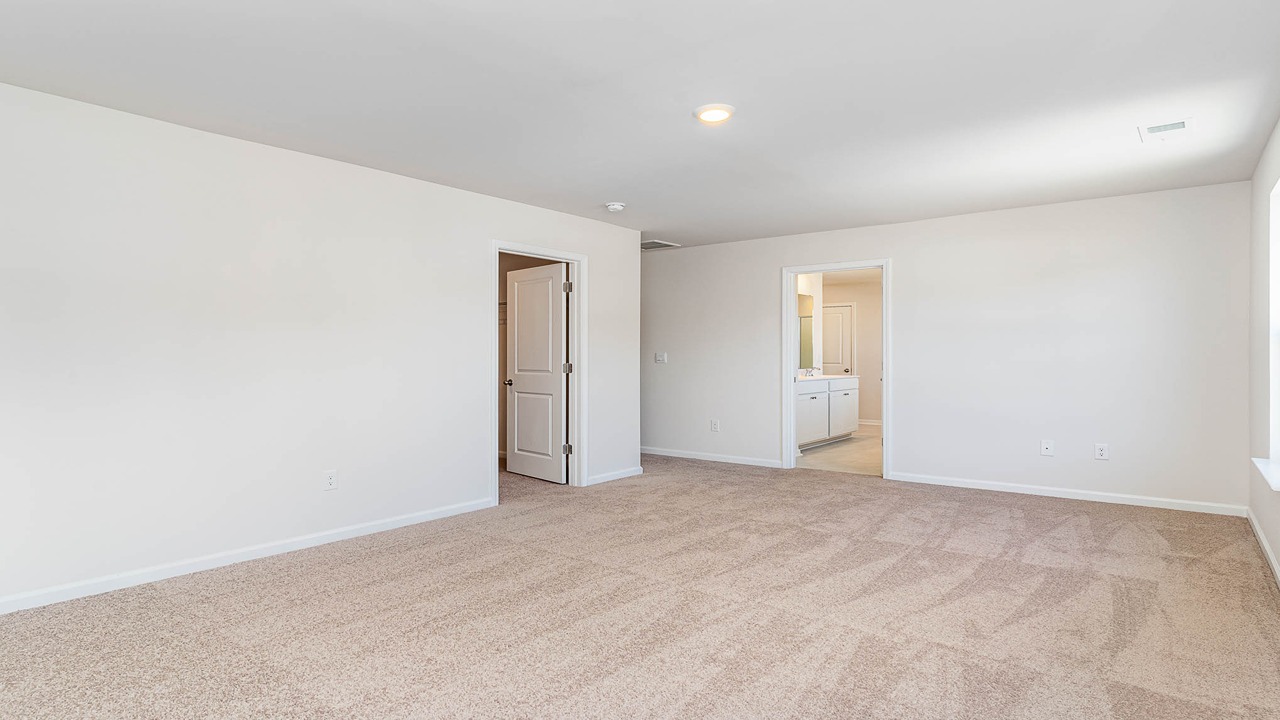 The primary bedroom is carpeted.