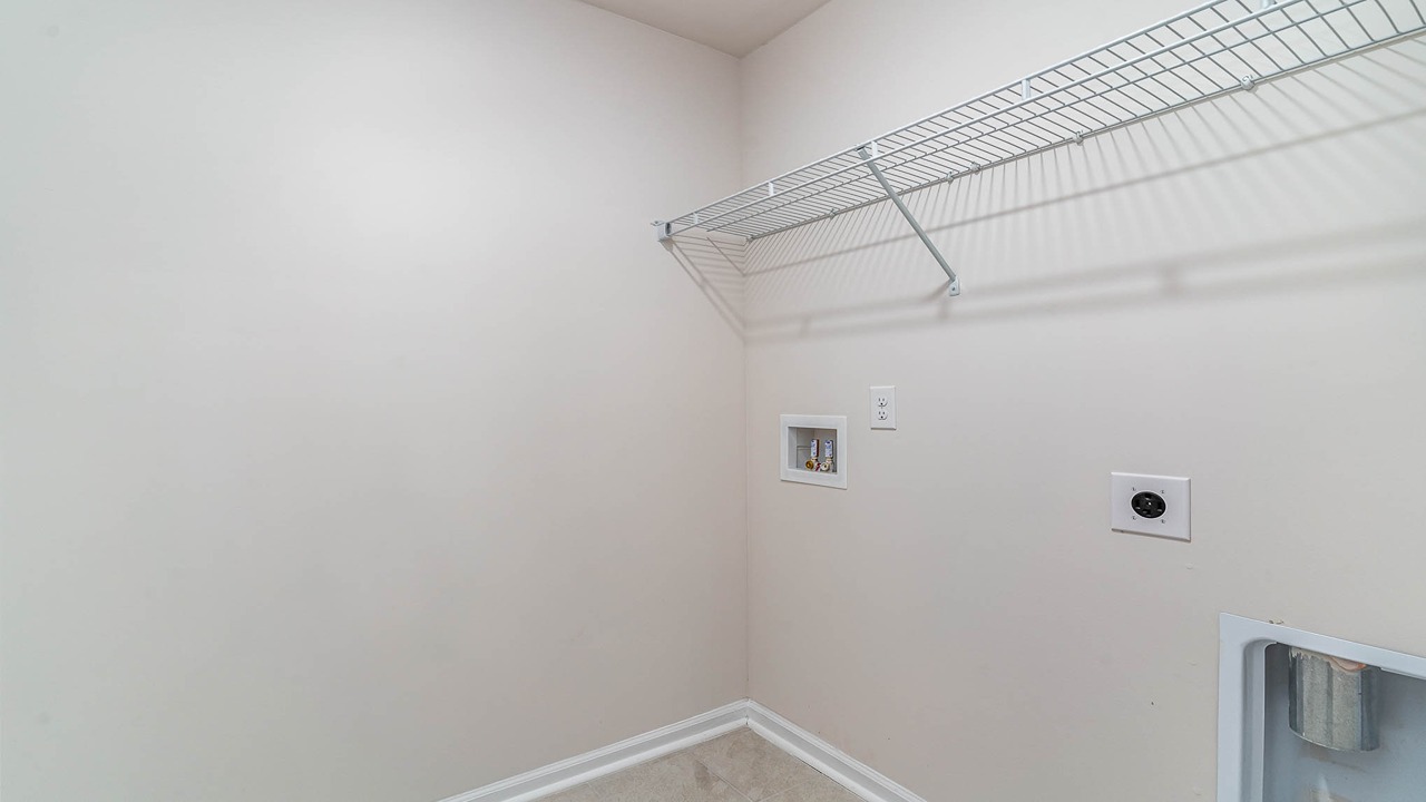 The laundry room is located upstairs.