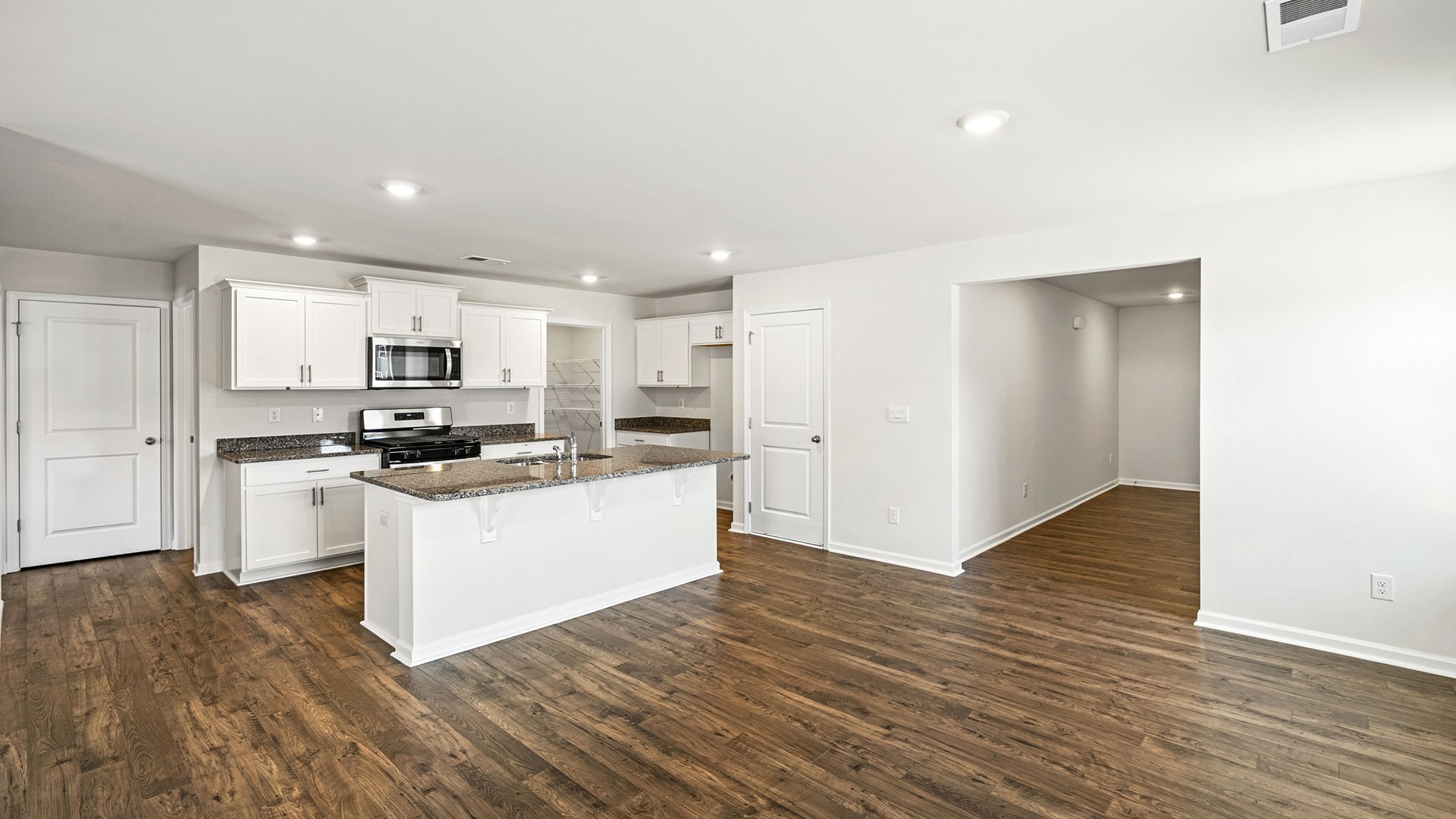 Robie kitchen with floating island and space for barstool seating