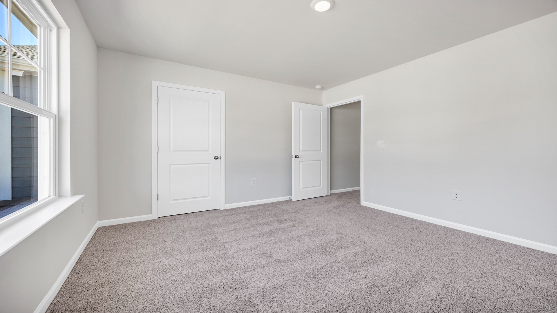 Private closet and plush carpet floors in bedroom 3 of the Hayden floorplan for sale in Lugoff, SC