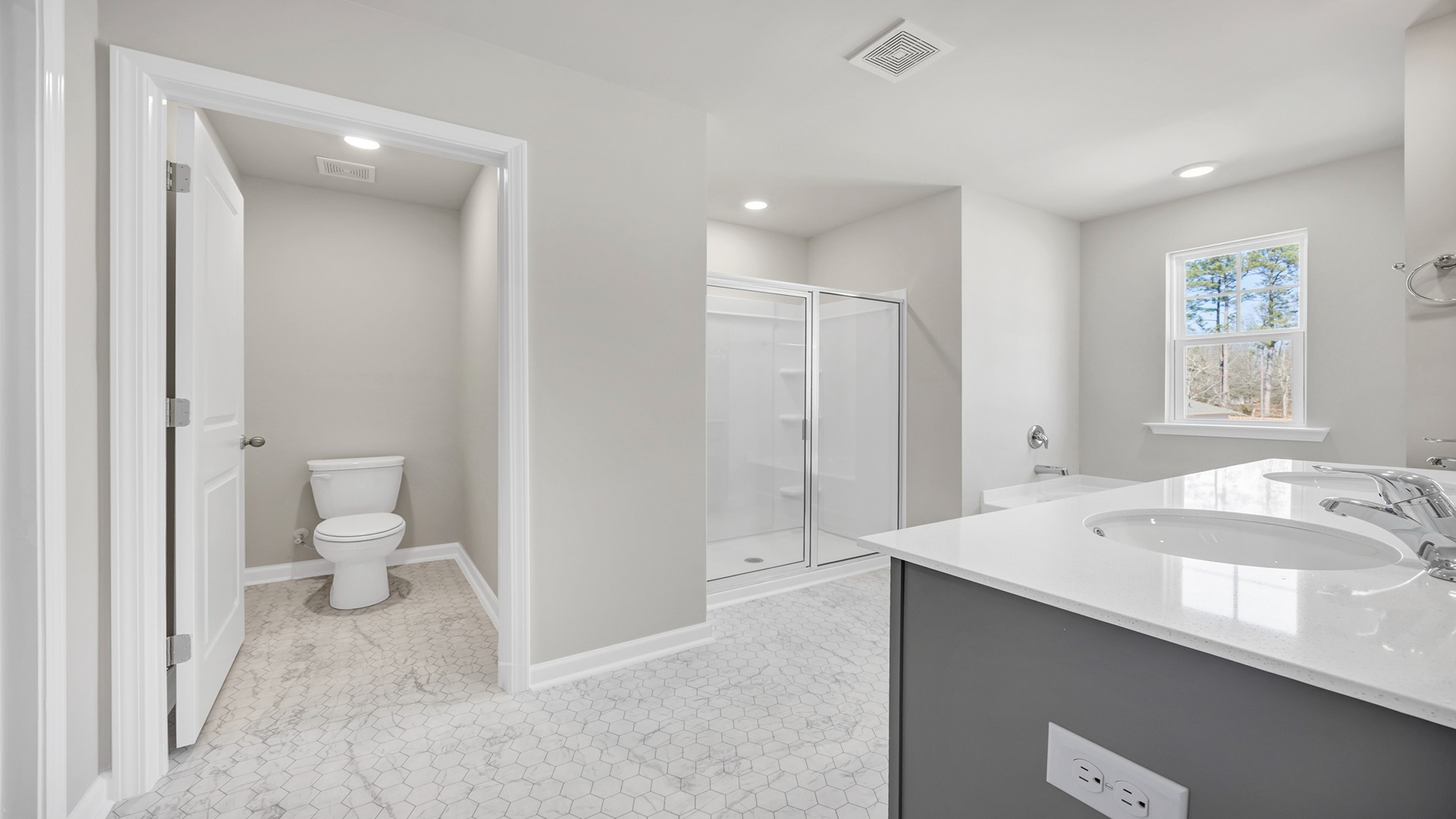 Separate water closet for toilet in the large, private primary bathroom