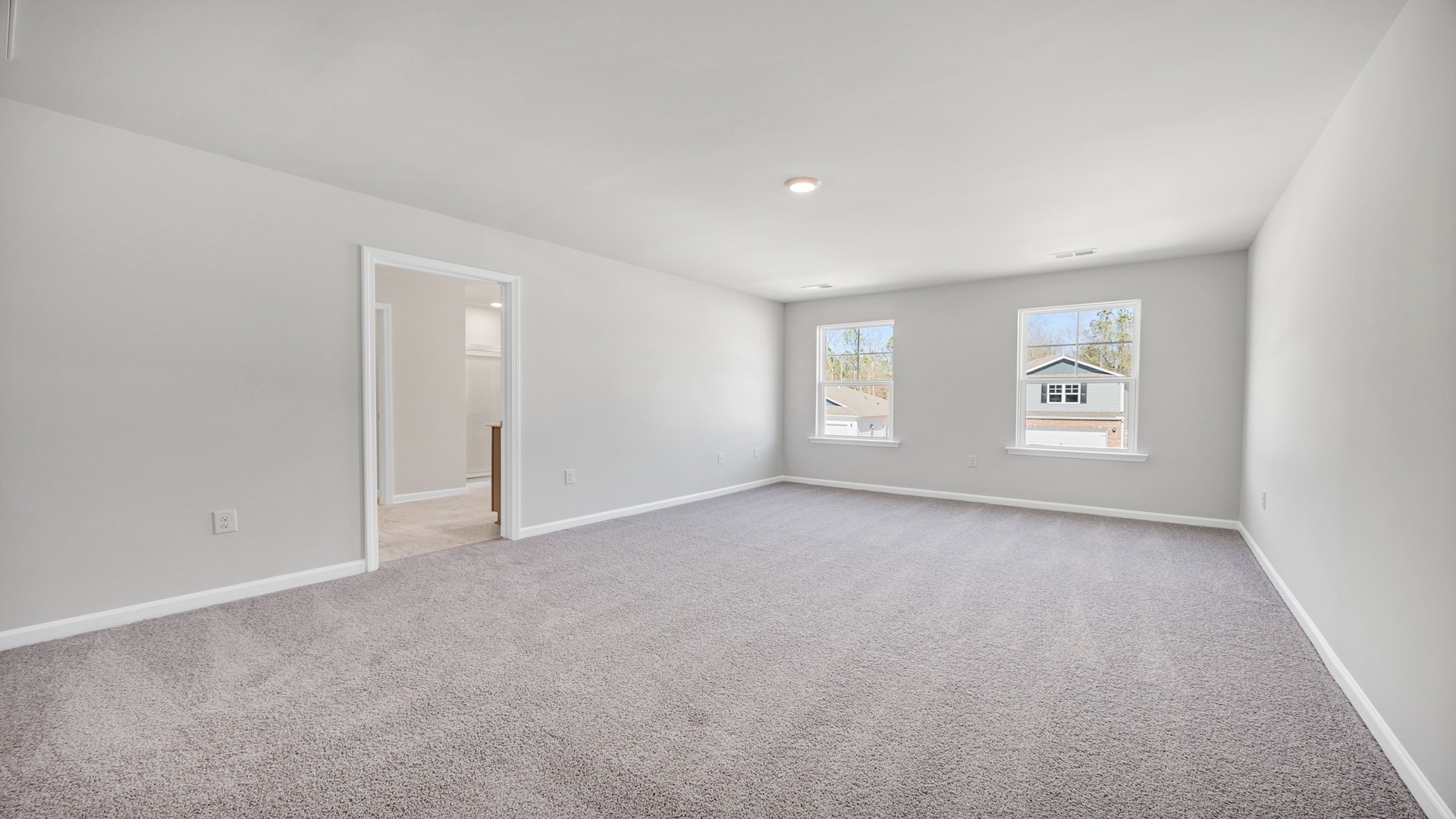 Very large primary bedroom upstairs in new construction home for sale with windows for natural light