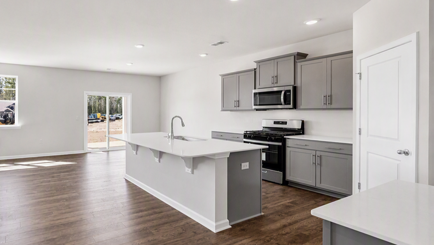 Modern, new kitchen in home for sale in Lugoff, SC with a floating island and gray cabinets