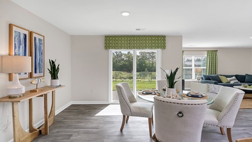 Ample natural light from dining area with sliding glass door