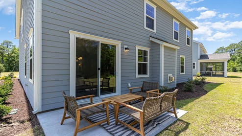There is a paved back patio at the back of the home.