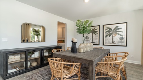 The flex space is staged as a formal dining area.