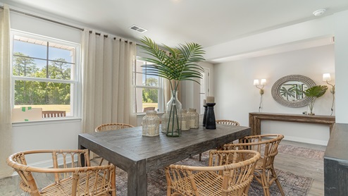The flex space is staged as a formal dining area.