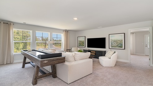 The upstairs loft space allows for a secondary living area.