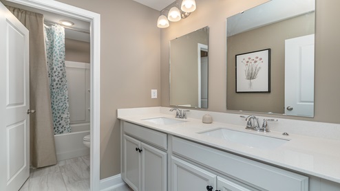 Full bathroom 3 is located upstairs between bedrooms 2 and 3.