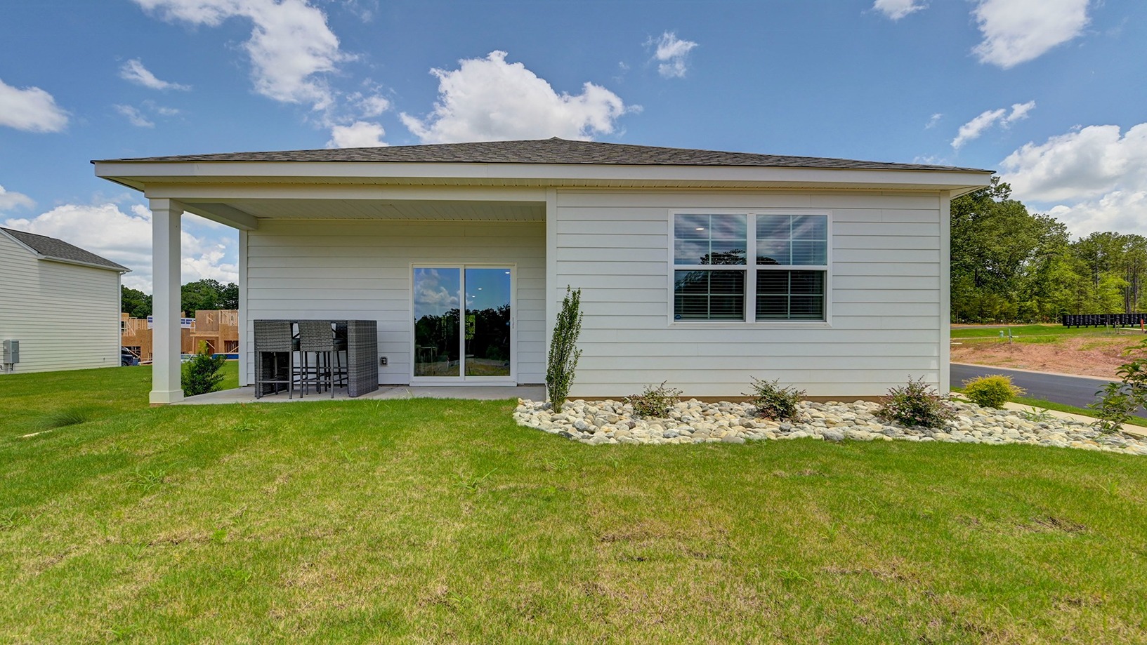There is a covered back patio at the back of the home.