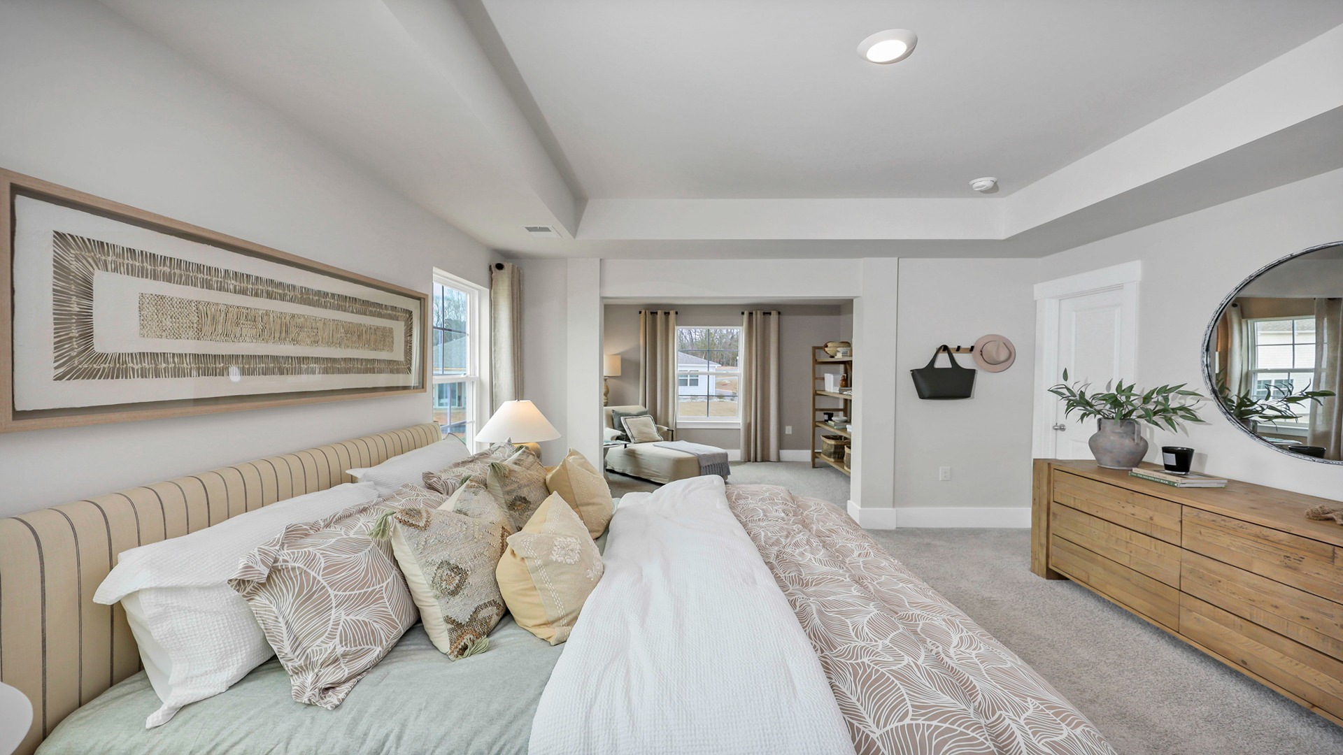 A king bed set comfortably fits in the primary bedroom