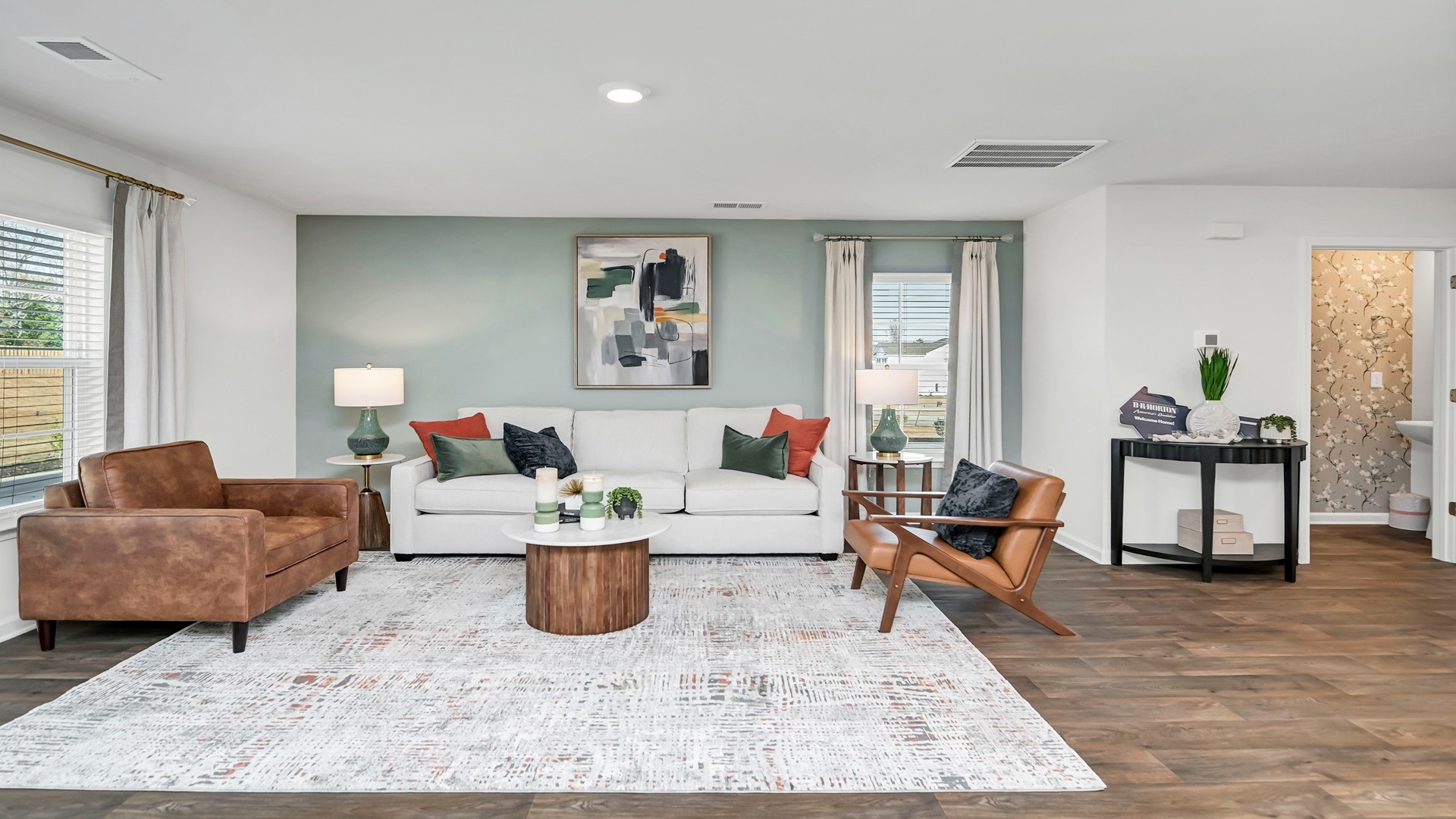 The kitchen, dining, and living areas flow seamlessly together.