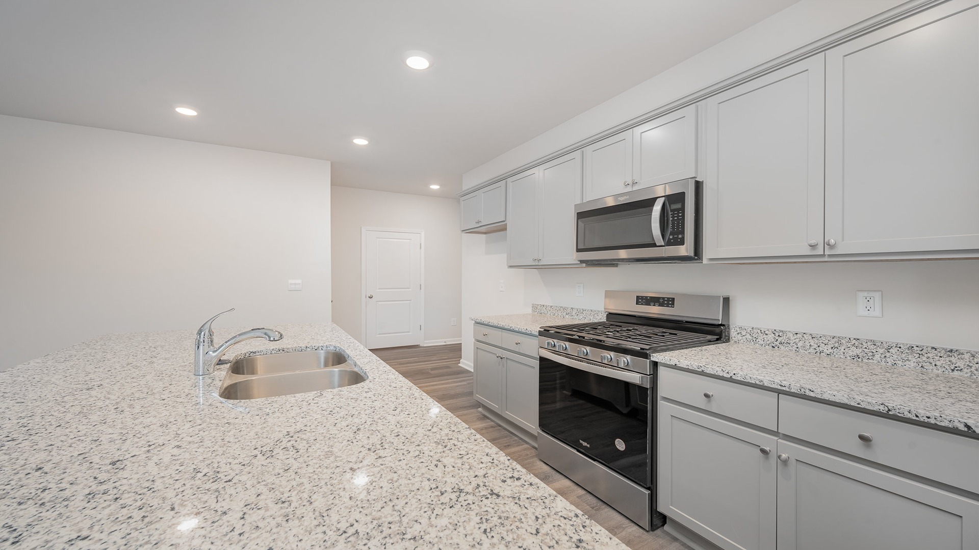 Wren kitchen with gray cabinetry.