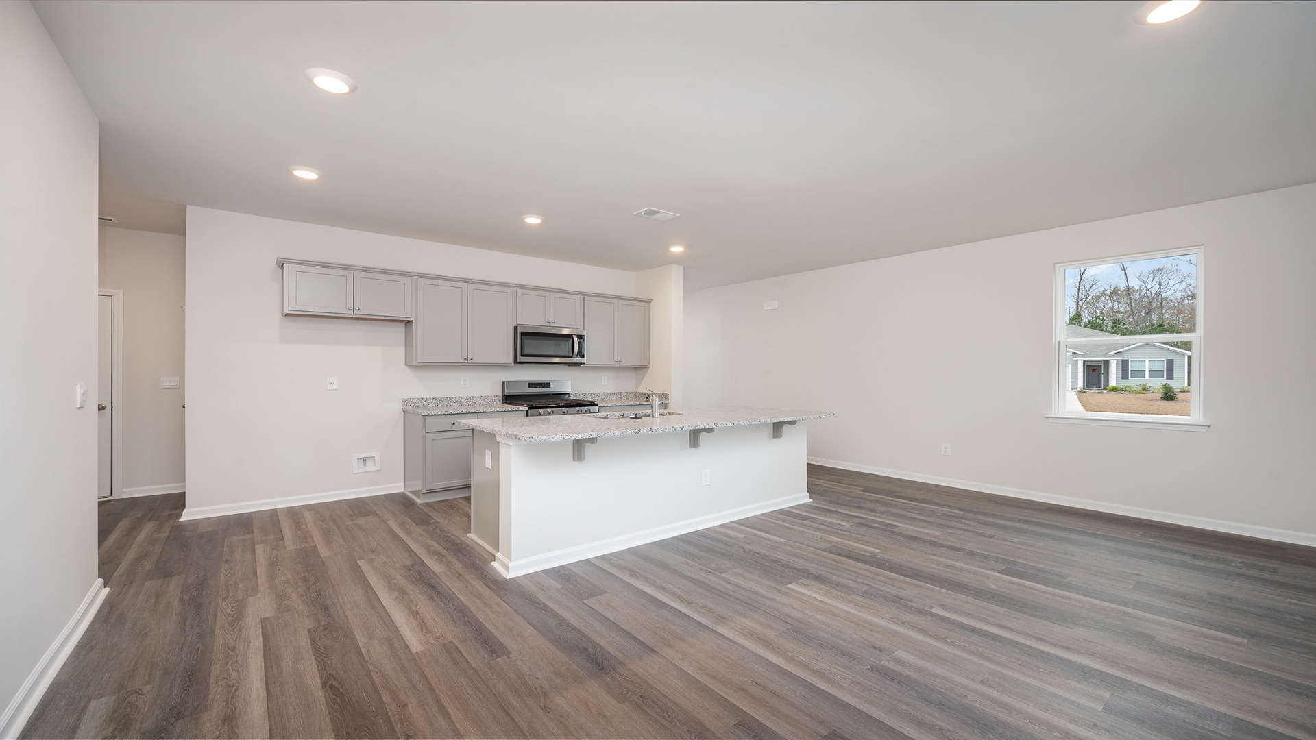 Open concept dining and kitchen areas.