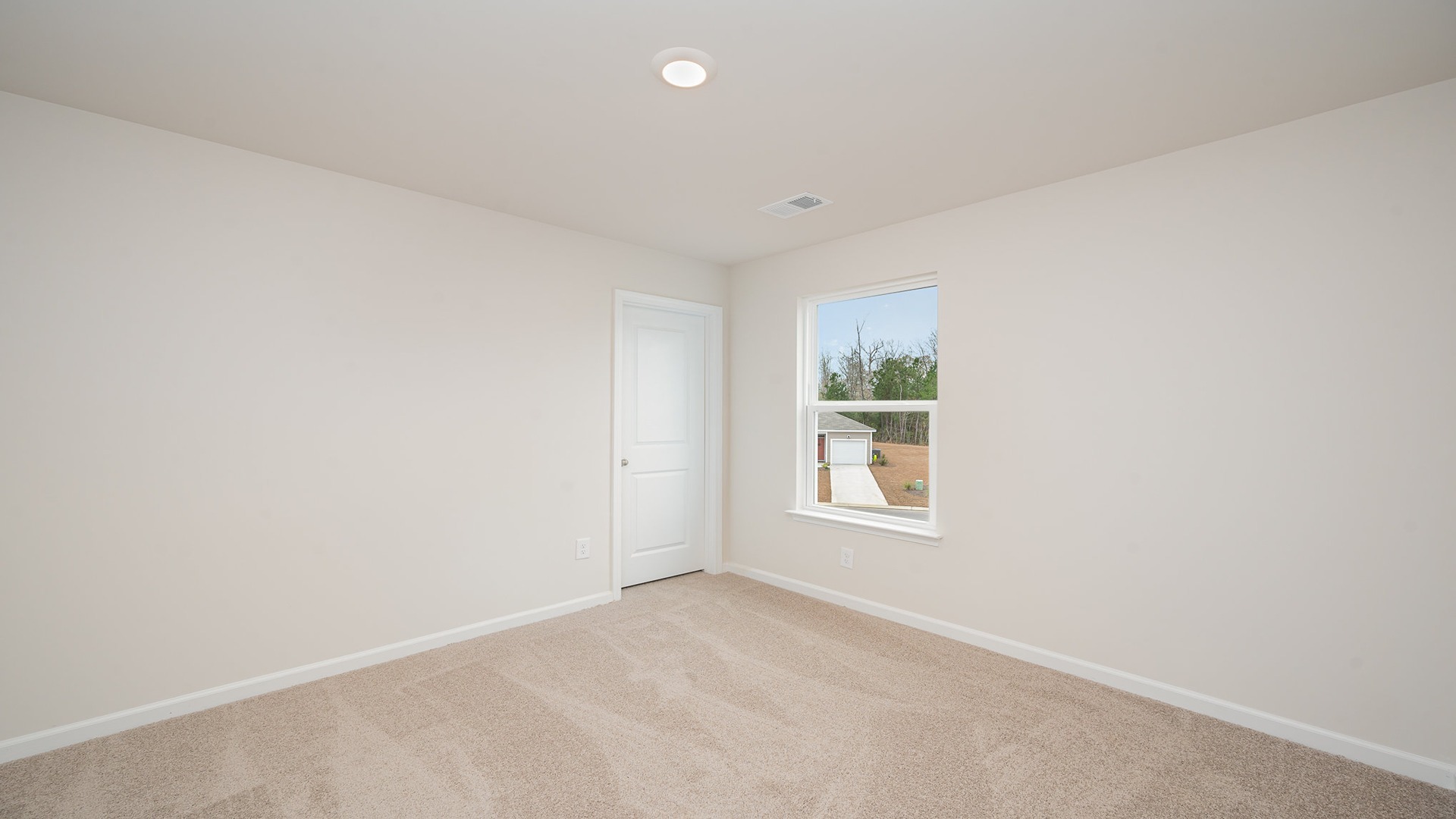 Bedroom 4 with carpet flooring and a window