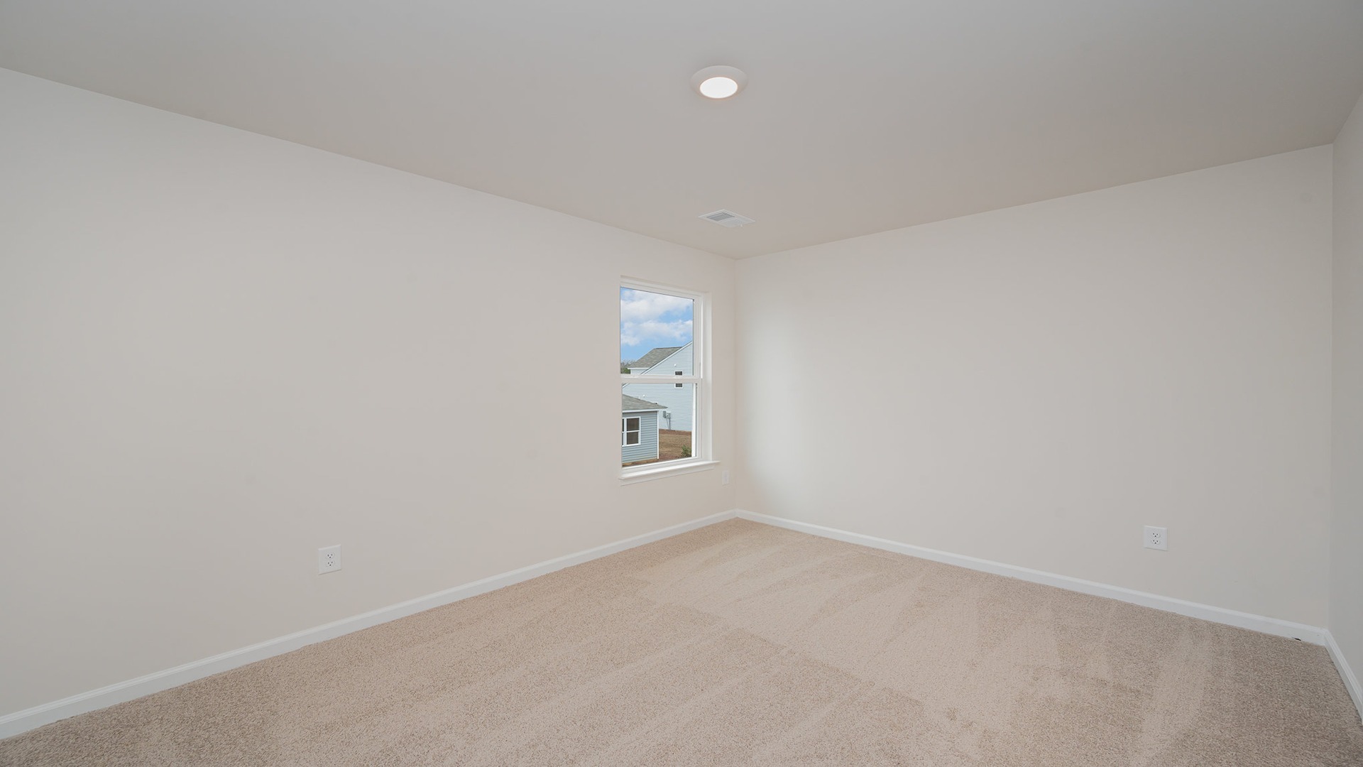 Bedroom 3 with a walk-in closet