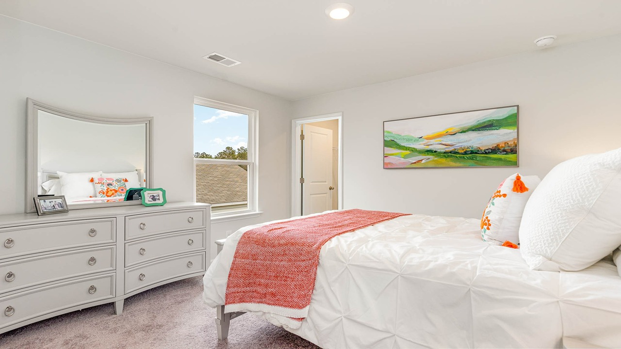 Bedroom 4 features carpet flooring and a window for light.