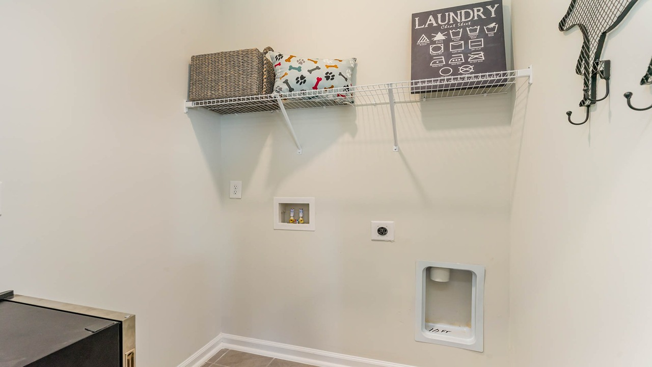 The laundry room is located upstairs.