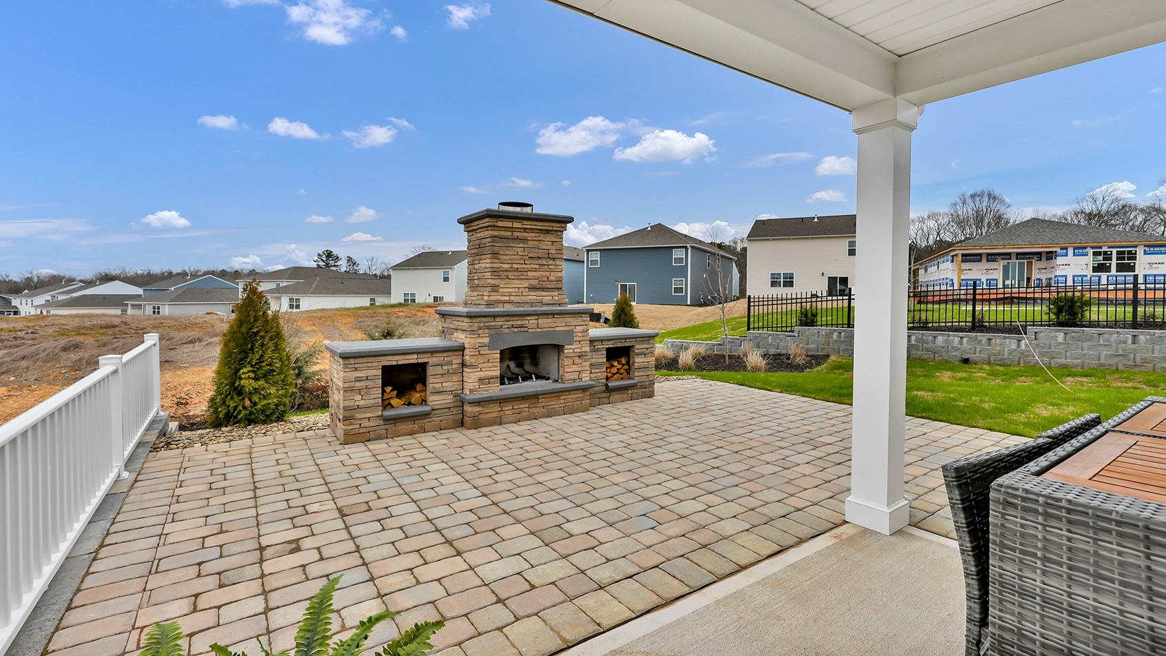 Downstairs back patio with extended hardscape
