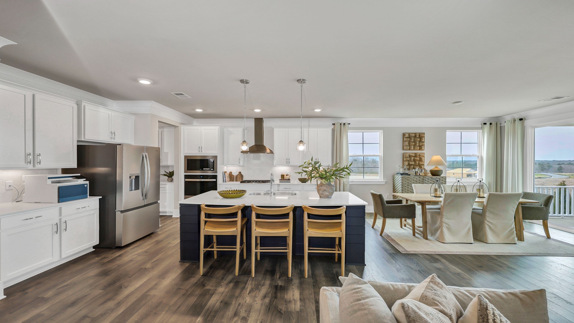 The kitchen and dining areas are open with natural light