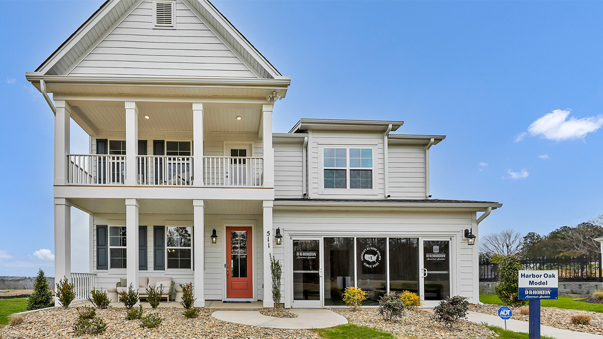 Harbor Oak with white Hardie Plank siding and a color-pop Coral door