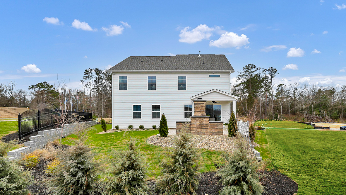 Back of home and backyard