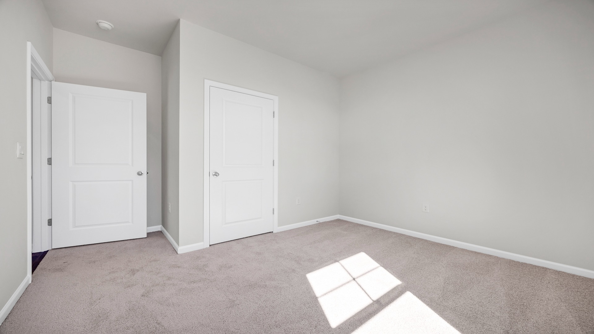 Bedrooms 2 and 3 are towards the front of the home with windows for light and private closets