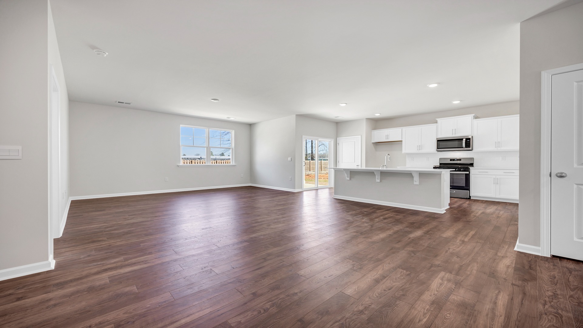 Kitchen, dining, and living areas are open concept