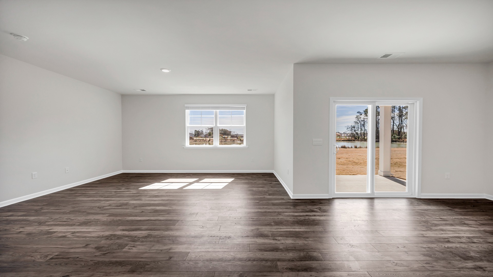Natural light and matching RevWood in the dining and living areas