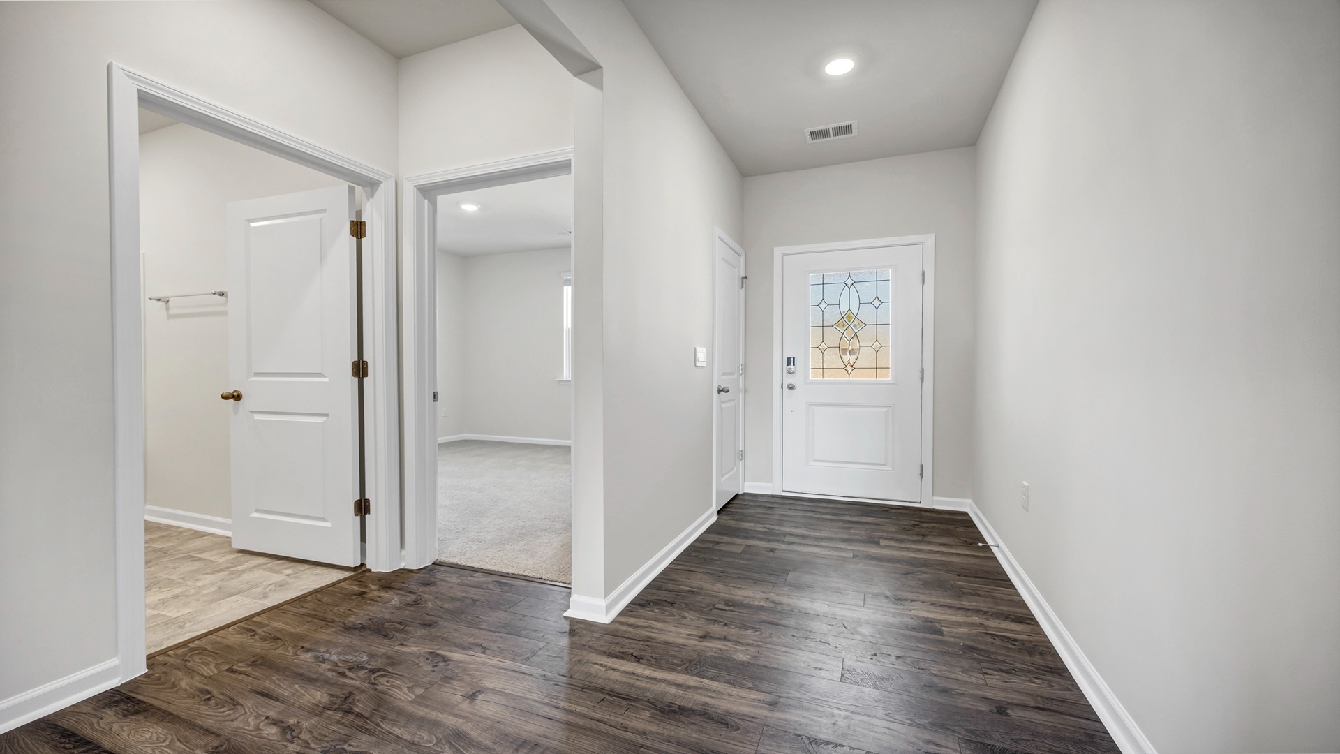 Front foyer/hallway leads to remaining 2 bedrooms and a shared bathroom