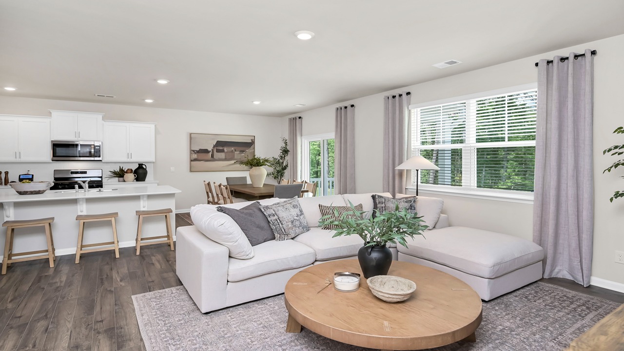 Open living space with natural light and RevWood flooring