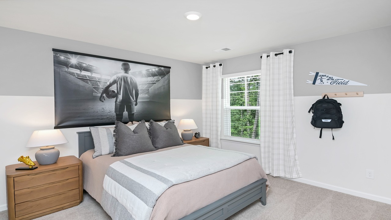Bedroom 4 upstairs with carpet flooring and a window