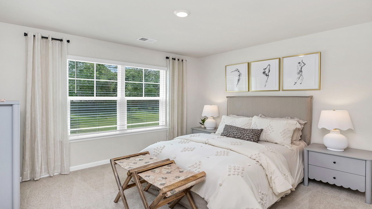 Bedroom 3 with large window and carpet floors