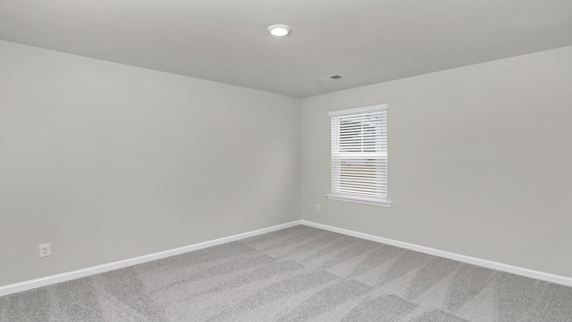 Bedroom 3 with carpet flooring and a window for light