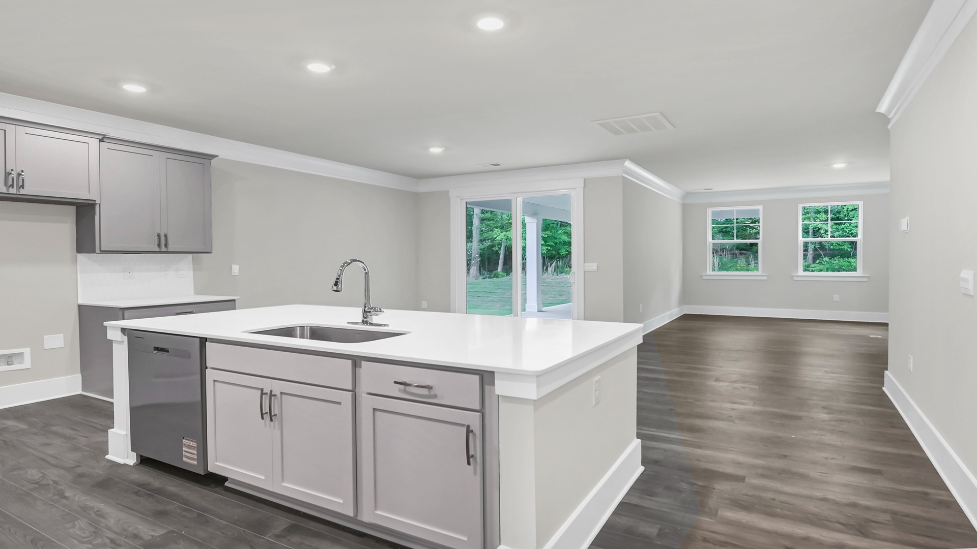 Floating kitchen island overlooking living and dining areas