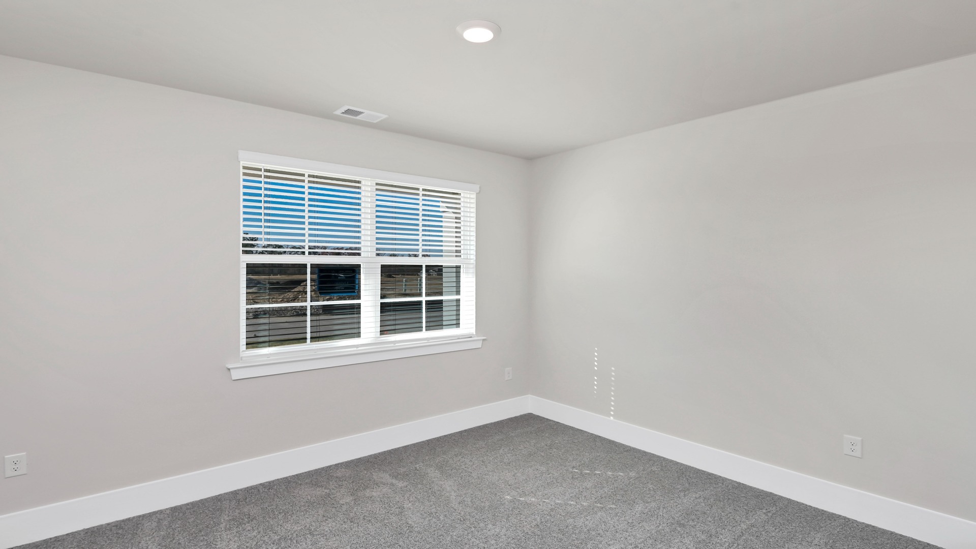 Bedroom 2 with carpet flooring and a window