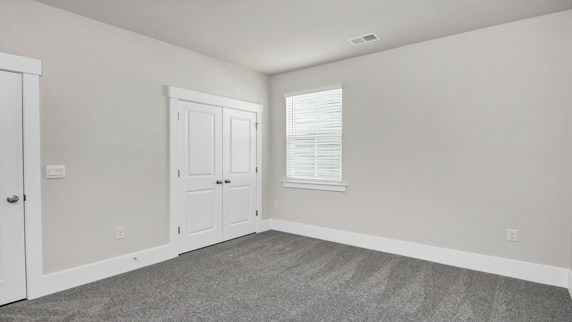 Bedroom 3 with carpet flooring and a window
