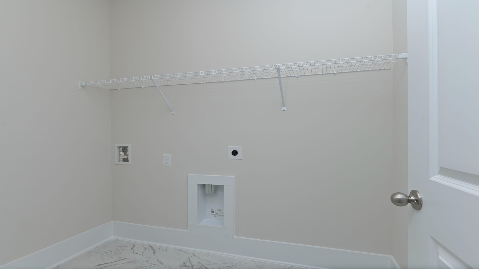 Laundry room with tile floors
